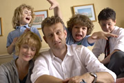 Outnumbered. Image shows from L to R: Karen (Ramona Marquez), Sue (Claire Skinner), Pete (Hugh Dennis), Ben (Daniel Roche), Jake (Tyger Drew-Honey). Image credit: Hat Trick Productions. Outnumbered. Image shows from L to R: Karen (Ramona Marquez), Sue (Claire Skinner), Pete (Hugh Dennis), Ben (Daniel Roche), Jake (Tyger Drew-Honey). Image credit: Hat Trick Productions.