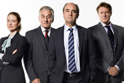 Yes, Prime Minister. Image shows from L to R: Claire Sutton (Zoe Telford), Sir Humphrey Appleby (Henry Goodman), Jim Hacker (David Haig), Bernard Woolley (Chris Larkin). Image credit: British Broadcasting Corporation. Yes, Prime Minister. Image shows from L to R: Claire Sutton (Zoe Telford), Sir Humphrey Appleby (Henry Goodman), Jim Hacker (David Haig), Bernard Woolley (Chris Larkin). Image credit: British Broadcasting Corporation.