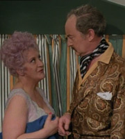 Are You Being Served?. Image shows from L to R: Mrs. Betty Slocombe (Mollie Sugden), Captain Stephen Peacock (Frank Thornton). Image credit: Anglo-EMI. Are You Being Served?. Image shows from L to R: Mrs. Betty Slocombe (Mollie Sugden), Captain Stephen Peacock (Frank Thornton). Image credit: Anglo-EMI.
