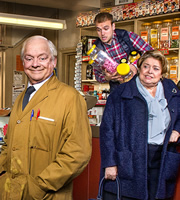 Still Open All Hours. Image shows from L to R: Granville (David Jason), Leroy (James Baxter), Nurse Gladys Emmanuel (Lynda Baron). Image credit: British Broadcasting Corporation. Still Open All Hours. Image shows from L to R: Granville (David Jason), Leroy (James Baxter), Nurse Gladys Emmanuel (Lynda Baron). Image credit: British Broadcasting Corporation.