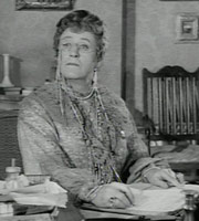The Belles Of St. Trinian's. Miss Millicent Fritton (Alastair Sim). Image credit: London Films. The Belles Of St. Trinian's. Miss Millicent Fritton (Alastair Sim). Image credit: London Films.