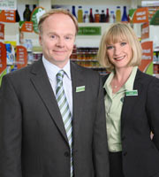 Trollied. Image shows from L to R: Gavin (Jason Watkins), Julie (Jane Horrocks). Image credit: Roughcut Television. Trollied. Image shows from L to R: Gavin (Jason Watkins), Julie (Jane Horrocks). Image credit: Roughcut Television.