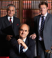 Yes, Prime Minister. Image shows from L to R: Sir Humphrey Appleby (Henry Goodman), Jim Hacker (David Haig), Bernard Woolley (Chris Larkin). Image credit: British Broadcasting Corporation. Yes, Prime Minister. Image shows from L to R: Sir Humphrey Appleby (Henry Goodman), Jim Hacker (David Haig), Bernard Woolley (Chris Larkin). Image credit: British Broadcasting Corporation.