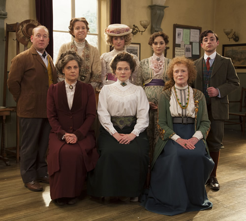 Up The Women. Image shows from L to R: Frank (Adrian Scarborough), Helen (Rebecca Front), Gwen (Vicki Pepperdine), Emily (Georgia Groome), Margaret (Jessica Hynes), Eva (Emma Pierson), Myrtle (Judy Parfitt), Thomas (Ryan Sampson). Image credit: British Broadcasting Corporation. Up The Women. Image shows from L to R: Frank (Adrian Scarborough), Helen (Rebecca Front), Gwen (Vicki Pepperdine), Emily (Georgia Groome), Margaret (Jessica Hynes), Eva (Emma Pierson), Myrtle (Judy Parfitt), Thomas (Ryan Sampson). Image credit: British Broadcasting Corporation.