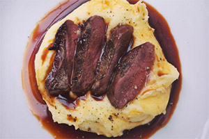 George Egg: Pigeon Breast with Creamed potato and a Beef and Dandelion sauce