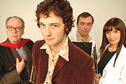 The Ape That Got Lucky. Image shows from L to R: Professor Austin Herring (Geoffrey McGivern), Chris Addison, Dan Tetsell, Jo Enright. Copyright: BBC. The Ape That Got Lucky. Image shows from L to R: Professor Austin Herring (Geoffrey McGivern), Chris Addison, Dan Tetsell, Jo Enright. Copyright: BBC.