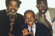 Desmond's. Image shows from L to R: Porkpie (Ram John Holder), Desmond (Norman Beaton), Matthew (Gyearbuor Asante). Copyright: Humphrey Barclay Productions. Desmond's. Image shows from L to R: Porkpie (Ram John Holder), Desmond (Norman Beaton), Matthew (Gyearbuor Asante). Copyright: Humphrey Barclay Productions.