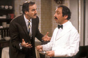 Fawlty Towers. Image shows from L to R: Basil Fawlty (John Cleese), Manuel (Andrew Sachs). Copyright: BBC. Fawlty Towers. Image shows from L to R: Basil Fawlty (John Cleese), Manuel (Andrew Sachs). Copyright: BBC.