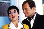 Hi-De-Hi!. Image shows from L to R: Gladys Pugh (Ruth Madoc), Sqdn-Ldr Clive Dempster DFC (David Griffin). Copyright: BBC. Hi-De-Hi!. Image shows from L to R: Gladys Pugh (Ruth Madoc), Sqdn-Ldr Clive Dempster DFC (David Griffin). Copyright: BBC.