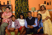 Meet The Adebanjos. Image shows from L to R: Tony (David Erdos), Tobi Adebanjo (Daniel Anthony), Gladys Adebanjo (Yetunde Oduwole), Bayo Adebanjo (Wale Ojo), Sade Adebanjo (Andrea Ama Aboagye), Aunty Funke (Moji Bamtefa). Copyright: MTA Productions. Meet The Adebanjos. Image shows from L to R: Tony (David Erdos), Tobi Adebanjo (Daniel Anthony), Gladys Adebanjo (Yetunde Oduwole), Bayo Adebanjo (Wale Ojo), Sade Adebanjo (Andrea Ama Aboagye), Aunty Funke (Moji Bamtefa). Copyright: MTA Productions.