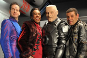 Red Dwarf. Image shows from L to R: Rimmer (Chris Barrie), Cat (Danny John-Jules), Kryten (Robert Llewellyn), Lister (Craig Charles). Copyright: Grant Naylor Productions / BBC. Red Dwarf. Image shows from L to R: Rimmer (Chris Barrie), Cat (Danny John-Jules), Kryten (Robert Llewellyn), Lister (Craig Charles). Copyright: Grant Naylor Productions / BBC.