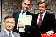 Yes Minister. Image shows from L to R: James Hacker (Paul Eddington), Sir Humphrey Appleby (Nigel Hawthorne), Bernard Woolley (Derek Fowlds). Copyright: BBC. Yes Minister. Image shows from L to R: James Hacker (Paul Eddington), Sir Humphrey Appleby (Nigel Hawthorne), Bernard Woolley (Derek Fowlds). Copyright: BBC.