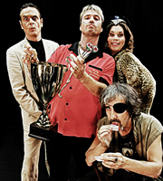 Good Arrows. Image shows from L to R: Sebastian (Joe McKinney), Andy 'The Arrows' Samson (Jonathan Owen), Big Sheila (Katy Brand), Alwyn (Brian Hibbard). Copyright: Jawbone. Good Arrows. Image shows from L to R: Sebastian (Joe McKinney), Andy 'The Arrows' Samson (Jonathan Owen), Big Sheila (Katy Brand), Alwyn (Brian Hibbard). Copyright: Jawbone.