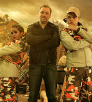 Hounded. Image shows from L to R: Captain Gelina / Gill (Eva Alexander), Rufus (Rufus Hound), Corporal Buck / Barry (Colin Ryan). Copyright: BBC. Hounded. Image shows from L to R: Captain Gelina / Gill (Eva Alexander), Rufus (Rufus Hound), Corporal Buck / Barry (Colin Ryan). Copyright: BBC.