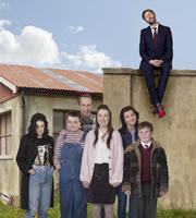 Moone Boy. Image shows from L to R: Trisha (Aoife Duffin), Sinead (Sarah White), Liam (Peter McDonald), Fidelma (Clare Monnelly), Debra (Deirdre O'Kane), Martin (David Rawle), Chris O'Dowd. Copyright: Baby Cow Productions / Sprout Pictures. Moone Boy. Image shows from L to R: Trisha (Aoife Duffin), Sinead (Sarah White), Liam (Peter McDonald), Fidelma (Clare Monnelly), Debra (Deirdre O'Kane), Martin (David Rawle), Chris O'Dowd. Copyright: Baby Cow Productions / Sprout Pictures.