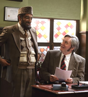 Citizen Khan. Image shows from L to R: Mr Khan (Adil Ray), Professor Stevens (James Fleet). Copyright: BBC. Citizen Khan. Image shows from L to R: Mr Khan (Adil Ray), Professor Stevens (James Fleet). Copyright: BBC.