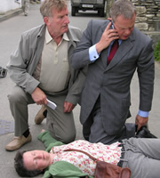 Doc Martin. Image shows from L to R: Clive Tishell (Malcolm Storry), Barbara (Georgie Glen), Dr Martin Ellingham (Martin Clunes). Copyright: Buffalo Pictures / Homerun Productions. Doc Martin. Image shows from L to R: Clive Tishell (Malcolm Storry), Barbara (Georgie Glen), Dr Martin Ellingham (Martin Clunes). Copyright: Buffalo Pictures / Homerun Productions.