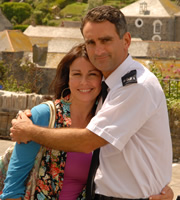 Doc Martin. Image shows from L to R: Maggie Reid (Julie Graham), PC Penhale (John Marquez). Copyright: Buffalo Pictures / Homerun Productions. Doc Martin. Image shows from L to R: Maggie Reid (Julie Graham), PC Penhale (John Marquez). Copyright: Buffalo Pictures / Homerun Productions.