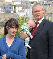Doc Martin. Image shows from L to R: Louisa Glasson (Caroline Catz), Dr Martin Ellingham (Martin Clunes). Copyright: Buffalo Pictures / Homerun Productions. Doc Martin. Image shows from L to R: Louisa Glasson (Caroline Catz), Dr Martin Ellingham (Martin Clunes). Copyright: Buffalo Pictures / Homerun Productions.