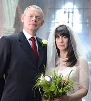 Doc Martin. Image shows from L to R: Dr Martin Ellingham (Martin Clunes), Louisa Glasson (Caroline Catz). Copyright: Buffalo Pictures / Homerun Productions. Doc Martin. Image shows from L to R: Dr Martin Ellingham (Martin Clunes), Louisa Glasson (Caroline Catz). Copyright: Buffalo Pictures / Homerun Productions.