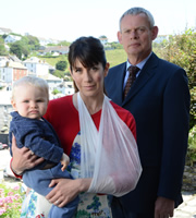 Doc Martin. Image shows from L to R: Louisa Glasson (Caroline Catz), Dr Martin Ellingham (Martin Clunes). Copyright: Buffalo Pictures / Homerun Productions. Doc Martin. Image shows from L to R: Louisa Glasson (Caroline Catz), Dr Martin Ellingham (Martin Clunes). Copyright: Buffalo Pictures / Homerun Productions.