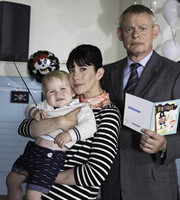 Doc Martin. Image shows from L to R: Louisa Glasson (Caroline Catz), Dr Martin Ellingham (Martin Clunes). Copyright: Buffalo Pictures / Homerun Productions. Doc Martin. Image shows from L to R: Louisa Glasson (Caroline Catz), Dr Martin Ellingham (Martin Clunes). Copyright: Buffalo Pictures / Homerun Productions.