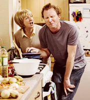 Father Figure. Image shows from L to R: Mary Whyte (Pauline McLynn), Tom Whyte (Jason Byrne). Copyright: BBC / Idil Sukan. Father Figure. Image shows from L to R: Mary Whyte (Pauline McLynn), Tom Whyte (Jason Byrne). Copyright: BBC / Idil Sukan.