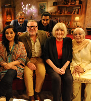 The Kumars. Image shows from L to R: Hawney (Harvey Virdi), Ashwin (Vincent Ebrahim), Ray Winstone, Sanjeev (Sanjeev Bhaskar), Diana Rigg, Ummi (Meera Syal). Copyright: Hat Trick Productions / Avatar. The Kumars. Image shows from L to R: Hawney (Harvey Virdi), Ashwin (Vincent Ebrahim), Ray Winstone, Sanjeev (Sanjeev Bhaskar), Diana Rigg, Ummi (Meera Syal). Copyright: Hat Trick Productions / Avatar.