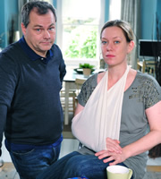 Lead Balloon. Image shows from L to R: Rick Spleen (Jack Dee), Magda (Anna Crilly). Copyright: Open Mike Productions. Lead Balloon. Image shows from L to R: Rick Spleen (Jack Dee), Magda (Anna Crilly). Copyright: Open Mike Productions.