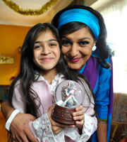 Little Crackers. Image shows from L to R: Young Meera (Narisa Padhiar), Meera Syal. Little Crackers. Image shows from L to R: Young Meera (Narisa Padhiar), Meera Syal.