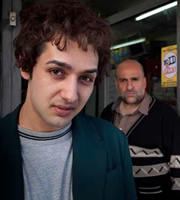 Little Crackers. Image shows from L to R: Omid (Ashley Kumar), Tobacconist (Omid Djalili). Little Crackers. Image shows from L to R: Omid (Ashley Kumar), Tobacconist (Omid Djalili).