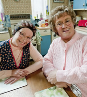 Mrs. Brown's Boys. Image shows from L to R: Winnie McGoogan (Eilish O'Carroll), Agnes Brown (Brendan O'Carroll). Copyright: BBC / BocPix. Mrs. Brown's Boys. Image shows from L to R: Winnie McGoogan (Eilish O'Carroll), Agnes Brown (Brendan O'Carroll). Copyright: BBC / BocPix.