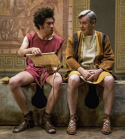 Plebs. Image shows from L to R: Stylax (Joel Fry), Gaius Maecenas (James Fleet). Copyright: RISE Films. Plebs. Image shows from L to R: Stylax (Joel Fry), Gaius Maecenas (James Fleet). Copyright: RISE Films.