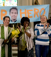 Rev.. Image shows from L to R: Rev Adam Smallbone (Tom Hollander), Adoha Onyeka (Ellen Thomas). Copyright: Big Talk Productions. Rev.. Image shows from L to R: Rev Adam Smallbone (Tom Hollander), Adoha Onyeka (Ellen Thomas). Copyright: Big Talk Productions.