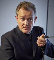 Rev.. Roland Wise (Hugh Bonneville). Copyright: Big Talk Productions. Rev.. Roland Wise (Hugh Bonneville). Copyright: Big Talk Productions.