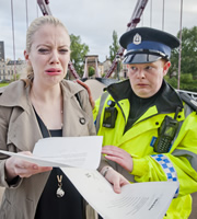 Scot Squad. Image shows from L to R: Rachel McGuigan (Meghan Tyler), Officer/Acting Sgt. Ken Beattie (James Allenby-Kirk). Copyright: The Comedy Unit. Scot Squad. Image shows from L to R: Rachel McGuigan (Meghan Tyler), Officer/Acting Sgt. Ken Beattie (James Allenby-Kirk). Copyright: The Comedy Unit.