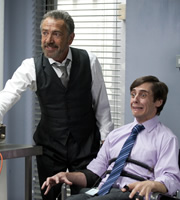 Spy. Image shows from L to R: The Examiner (Robert Lindsay), Moritz (Ed Coleman). Copyright: Hat Trick Productions. Spy. Image shows from L to R: The Examiner (Robert Lindsay), Moritz (Ed Coleman). Copyright: Hat Trick Productions.