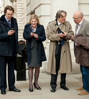 The Thick Of It. Image shows from L to R: Phil Smith (Will Smith), Emma Messinger (Olivia Poulet), Peter Mannion (Roger Allam), Stewart Pearson (Vincent Franklin). Copyright: BBC. The Thick Of It. Image shows from L to R: Phil Smith (Will Smith), Emma Messinger (Olivia Poulet), Peter Mannion (Roger Allam), Stewart Pearson (Vincent Franklin). Copyright: BBC.