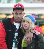 Trollied. Image shows from L to R: MC Poison (Sean Sagar), Sophie (Georgia Henshaw). Copyright: Roughcut Television. Trollied. Image shows from L to R: MC Poison (Sean Sagar), Sophie (Georgia Henshaw). Copyright: Roughcut Television.