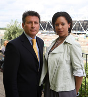 Twenty Twelve. Image shows from L to R: Sebastian Coe, Nina (Nina Sosanya). Copyright: BBC. Twenty Twelve. Image shows from L to R: Sebastian Coe, Nina (Nina Sosanya). Copyright: BBC.