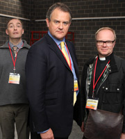 Twenty Twelve. Image shows from L to R: Mike Whitaker (Neil Edmond), Ian Fletcher (Hugh Bonneville), Richard Salter (Jason Watkins). Copyright: BBC. Twenty Twelve. Image shows from L to R: Mike Whitaker (Neil Edmond), Ian Fletcher (Hugh Bonneville), Richard Salter (Jason Watkins). Copyright: BBC.