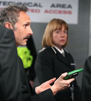 Twenty Twelve. Image shows from L to R: Graham Hitchins (Karl Theobald), Deputy Asst. Commissioner Rachel Crane (Robin Weaver). Copyright: BBC. Twenty Twelve. Image shows from L to R: Graham Hitchins (Karl Theobald), Deputy Asst. Commissioner Rachel Crane (Robin Weaver). Copyright: BBC.