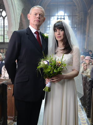 Doc Martin. Image shows from L to R: Dr Martin Ellingham (Martin Clunes), Louisa Glasson (Caroline Catz). Copyright: Buffalo Pictures / Homerun Productions. Doc Martin. Image shows from L to R: Dr Martin Ellingham (Martin Clunes), Louisa Glasson (Caroline Catz). Copyright: Buffalo Pictures / Homerun Productions.