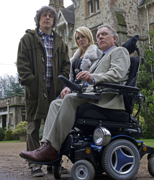 Jonathan Creek. Image shows from L to R: Jonathan Creek (Alan Davies), Joey Ross (Sheridan Smith), D.I. Gideon Pryke (Rik Mayall). Copyright: BBC. Jonathan Creek. Image shows from L to R: Jonathan Creek (Alan Davies), Joey Ross (Sheridan Smith), D.I. Gideon Pryke (Rik Mayall). Copyright: BBC.