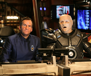 Red Dwarf. Image shows from L to R: Rimmer (Chris Barrie), Kryten (Robert Llewellyn). Copyright: Grant Naylor Productions / BBC. Red Dwarf. Image shows from L to R: Rimmer (Chris Barrie), Kryten (Robert Llewellyn). Copyright: Grant Naylor Productions / BBC.