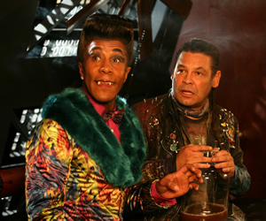Red Dwarf. Image shows from L to R: Cat (Danny John-Jules), Lister (Craig Charles). Copyright: Grant Naylor Productions / BBC. Red Dwarf. Image shows from L to R: Cat (Danny John-Jules), Lister (Craig Charles). Copyright: Grant Naylor Productions / BBC.