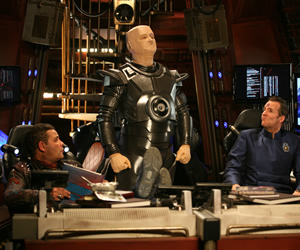 Red Dwarf. Image shows from L to R: Lister (Craig Charles), Kryten (Robert Llewellyn), Rimmer (Chris Barrie). Copyright: Grant Naylor Productions / BBC. Red Dwarf. Image shows from L to R: Lister (Craig Charles), Kryten (Robert Llewellyn), Rimmer (Chris Barrie). Copyright: Grant Naylor Productions / BBC.