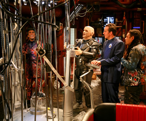 Red Dwarf. Image shows from L to R: Cat (Danny John-Jules), Kryten (Robert Llewellyn), Rimmer (Chris Barrie), Lister (Craig Charles). Copyright: Grant Naylor Productions / BBC. Red Dwarf. Image shows from L to R: Cat (Danny John-Jules), Kryten (Robert Llewellyn), Rimmer (Chris Barrie), Lister (Craig Charles). Copyright: Grant Naylor Productions / BBC.
