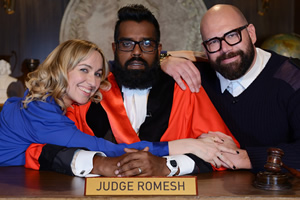 Judge Romesh. Image shows from L to R: Court Clerk (Kerry Howard), Romesh Ranganathan, Court Bailiff (Tom Davis). Copyright: Hungry Bear Media. Judge Romesh. Image shows from L to R: Court Clerk (Kerry Howard), Romesh Ranganathan, Court Bailiff (Tom Davis). Copyright: Hungry Bear Media.