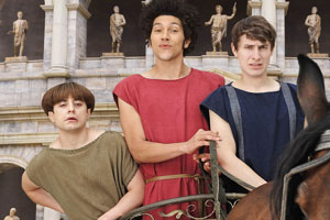Plebs. Image shows from L to R: Grumio (Ryan Sampson), Stylax (Joel Fry), Marcus (Tom Rosenthal). Copyright: RISE Films. Plebs. Image shows from L to R: Grumio (Ryan Sampson), Stylax (Joel Fry), Marcus (Tom Rosenthal). Copyright: RISE Films.